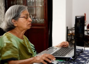 Asian old woman using computer